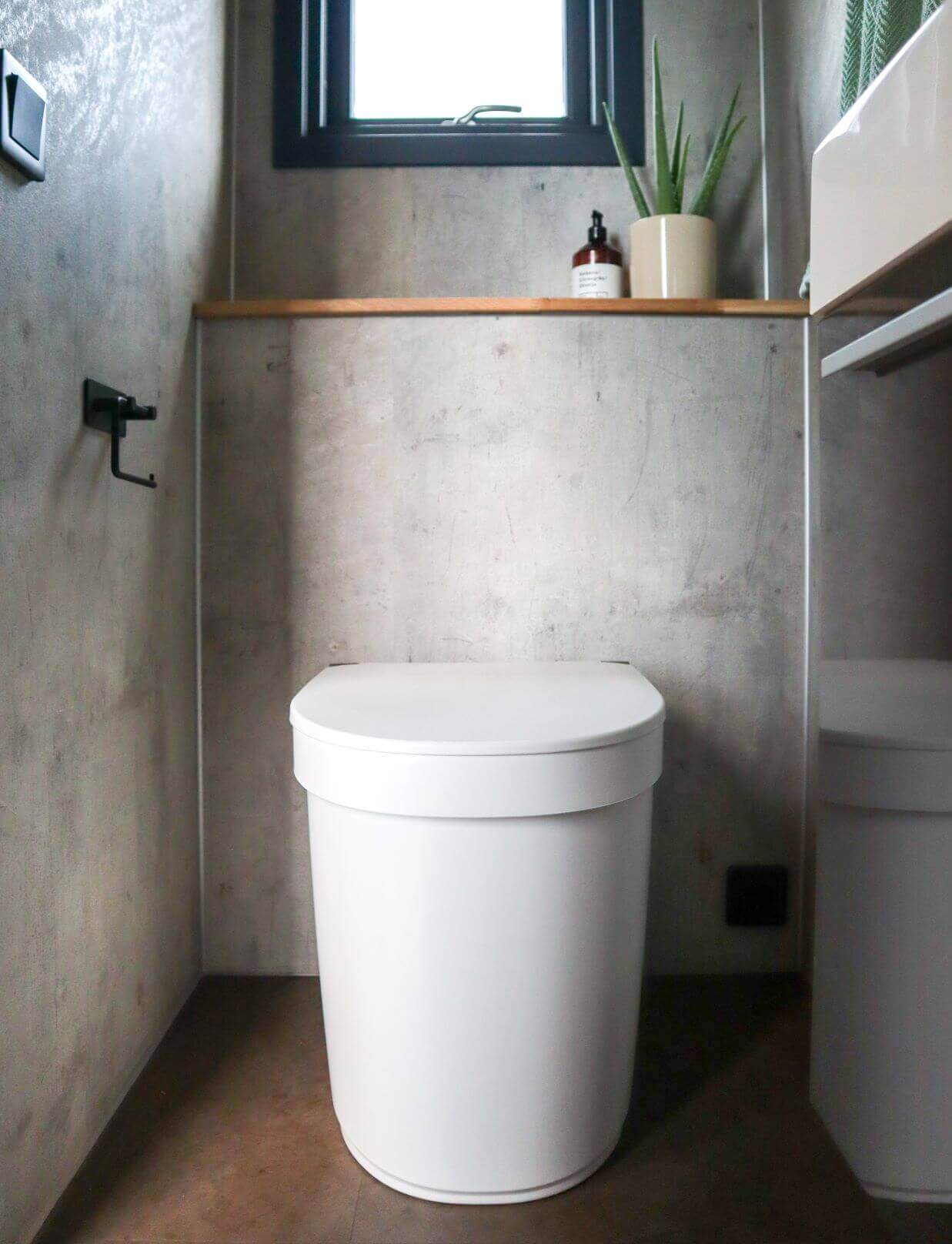 Separett Tiny 1271 toilet in modern compact bathroom, ideal for RVs and cabins, available at Cabin Depot.