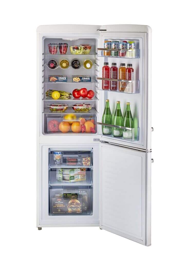 Open Unique 9 Cu/Ft Bottom Mount Retro Refrigerator available at Cabin Depot, showcasing spacious interior with bottled and fresh produce.