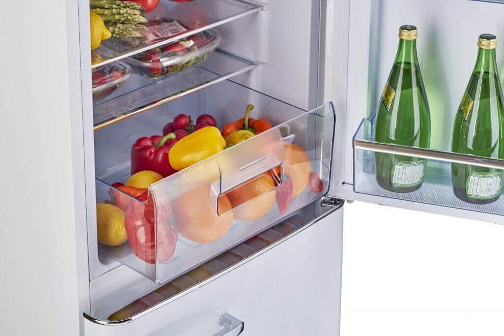 Open view of Unique 9 cu ft Retro Bottom Mount Refrigerator filled with fruits and vegetables, available at Cabin Depot.