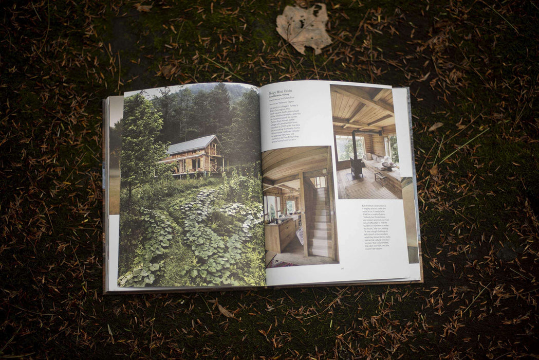 Open "Cabin Porn Inside" book showcasing cabin interiors and exteriors. Discover tranquility with Cabin Depot's inspiring guide.