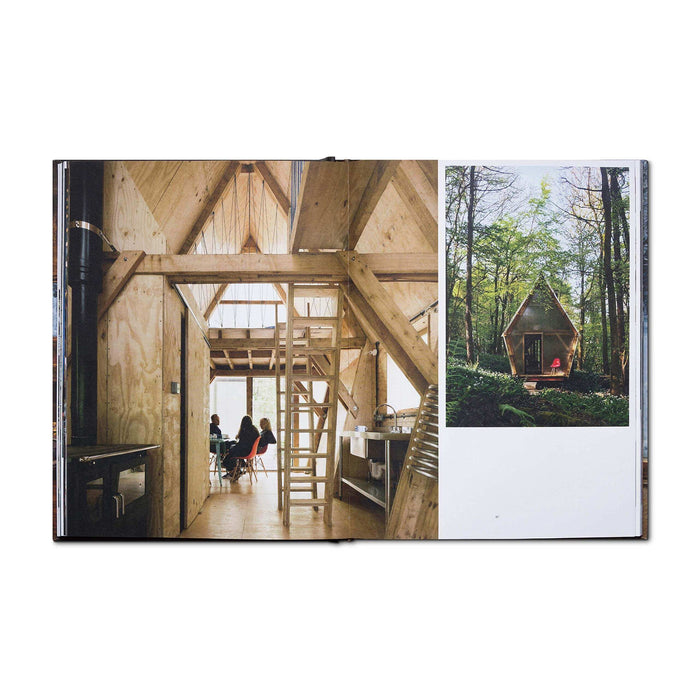Open "Cabin Porn Inside" book showcasing tranquil cabin interiors, inspiring homebuilding. Available at Cabin Depot.