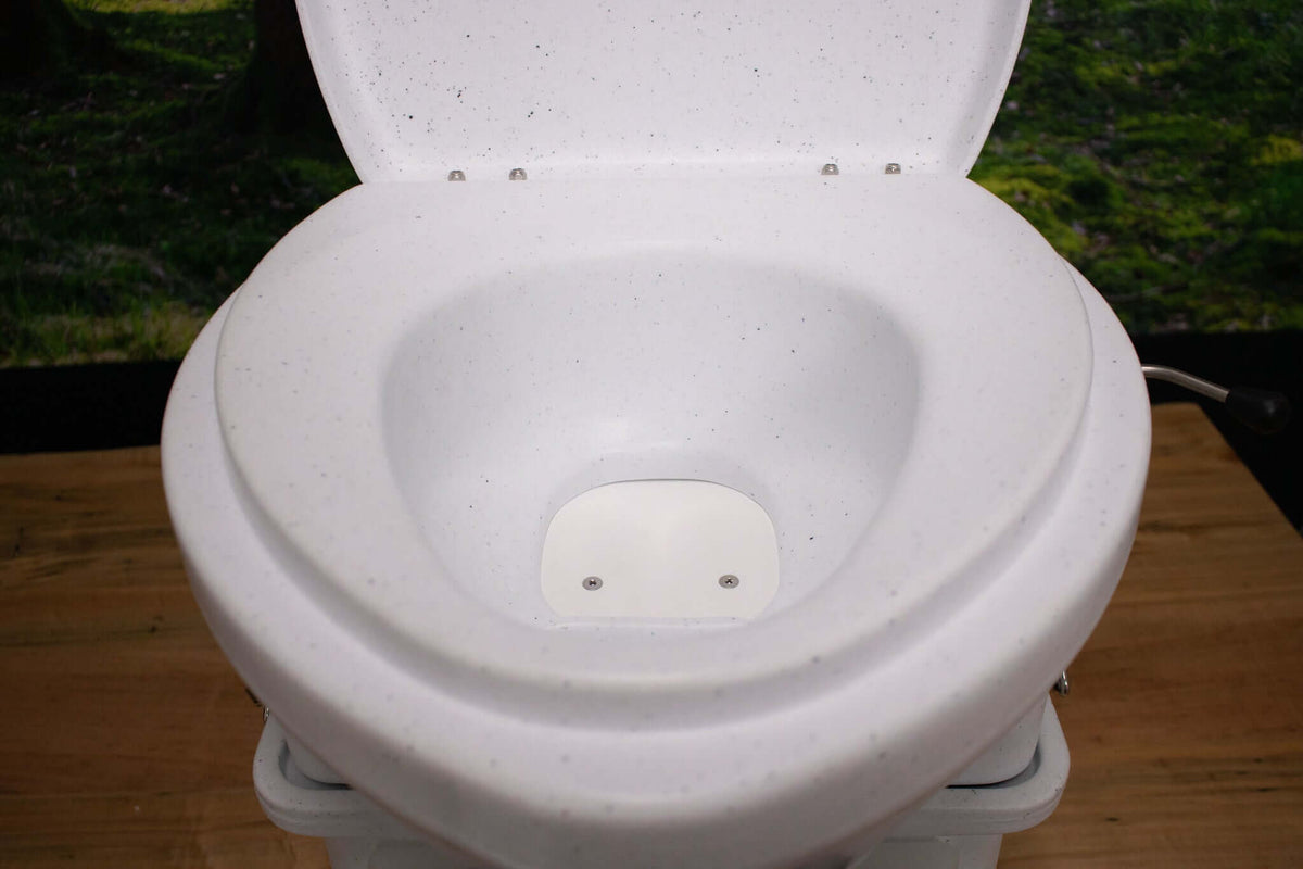 Nature's Head composting toilet with foot spider handle, available at Cabin Depot for off-grid living