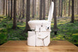 Nature's Head composting toilet with foot spider handle, available at Cabin Depot, set against a forest backdrop, ideal for off-grid living.