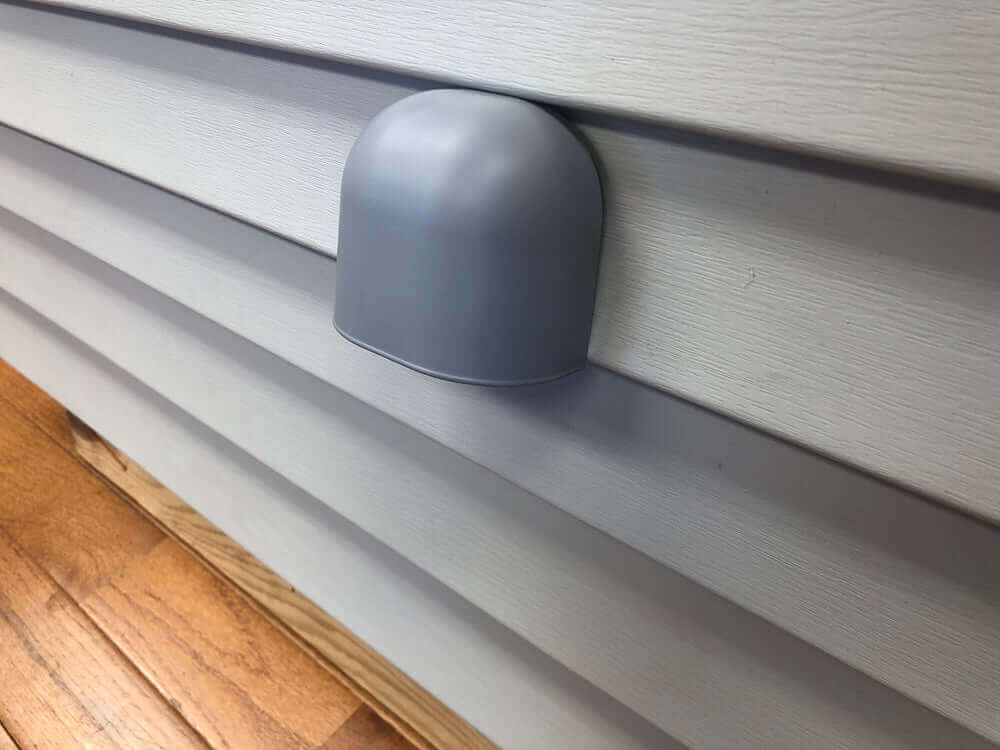Exterior wall vent cover installed on siding for home ventilation