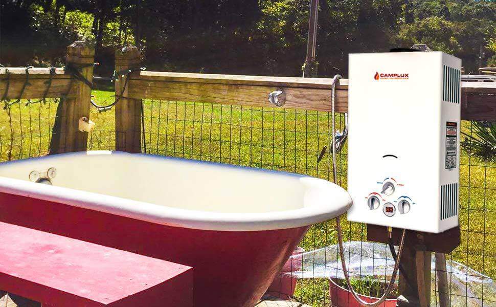 Camplux 10L Propane Portable Outdoor Tankless Water Heater next to outdoor bathtub at Cabin Depot