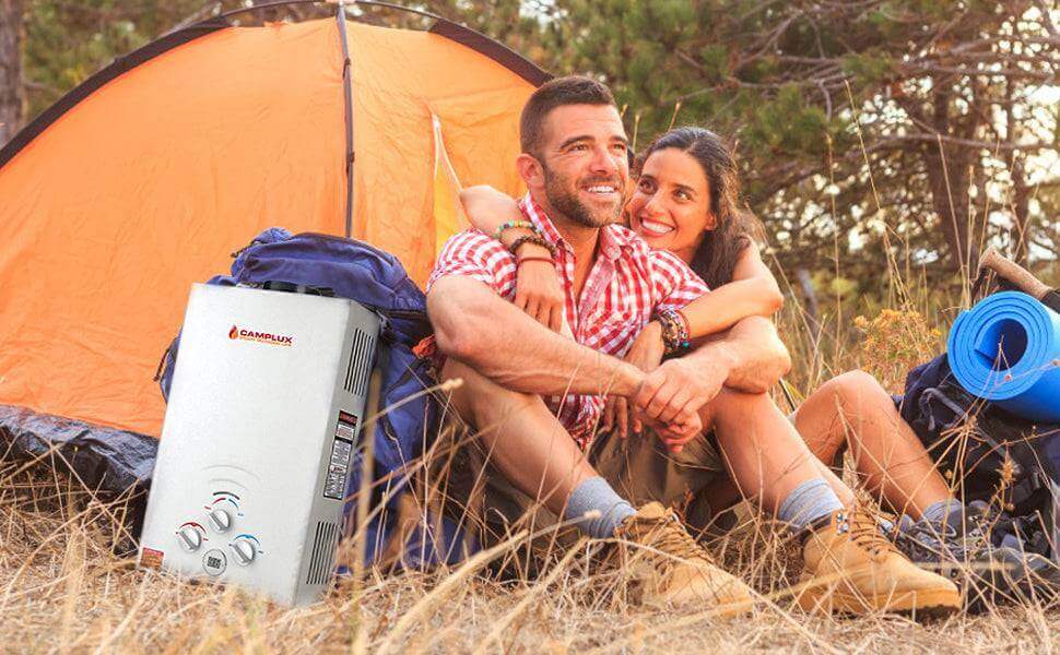 Couple camping with Camplux 8L propane tankless water heater, ideal for outdoor showers, cabin use, and off-grid living. Available at Cabin Depot.