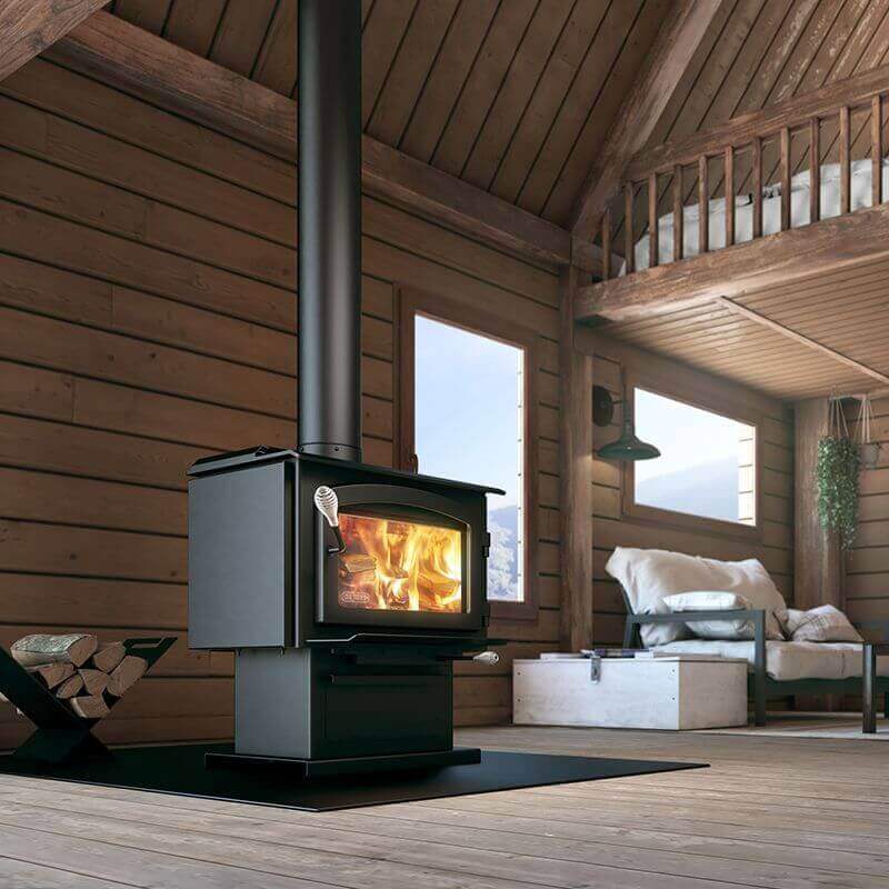 Drolet Escape 1800 Wood Stove heating a cozy cabin interior, available at Cabin Depot. EPA certified, 8-hour burn time, free shipping.