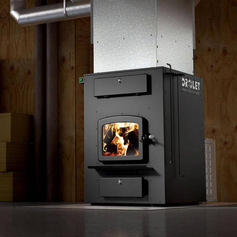 Drolet Heat Commander Wood Furnace in action, available at Cabin Depot with free shipping, innovative and EPA certified heating solution.