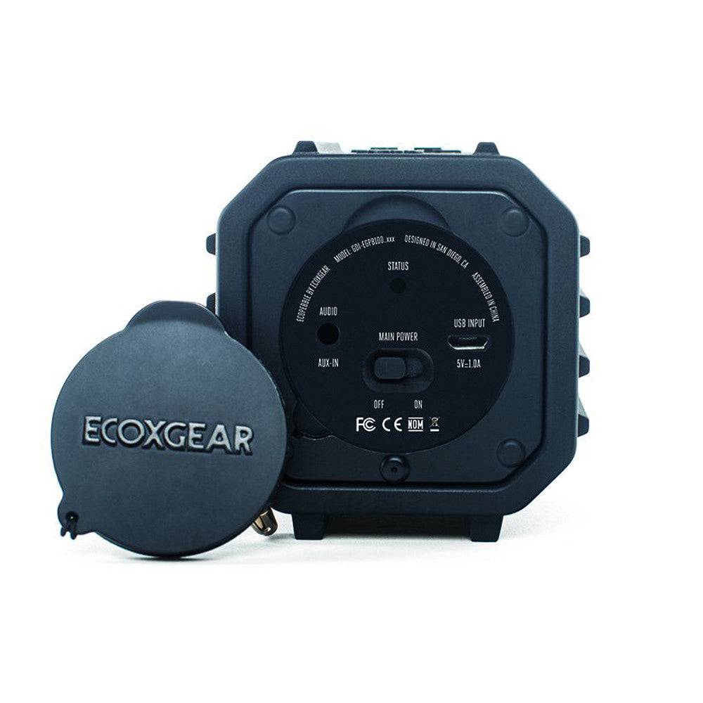 Back view of ECOXGEAR ECOPEBBLE waterproof Bluetooth speaker in orange, sold by Cabin Depot, showcasing rugged design and connectivity features.