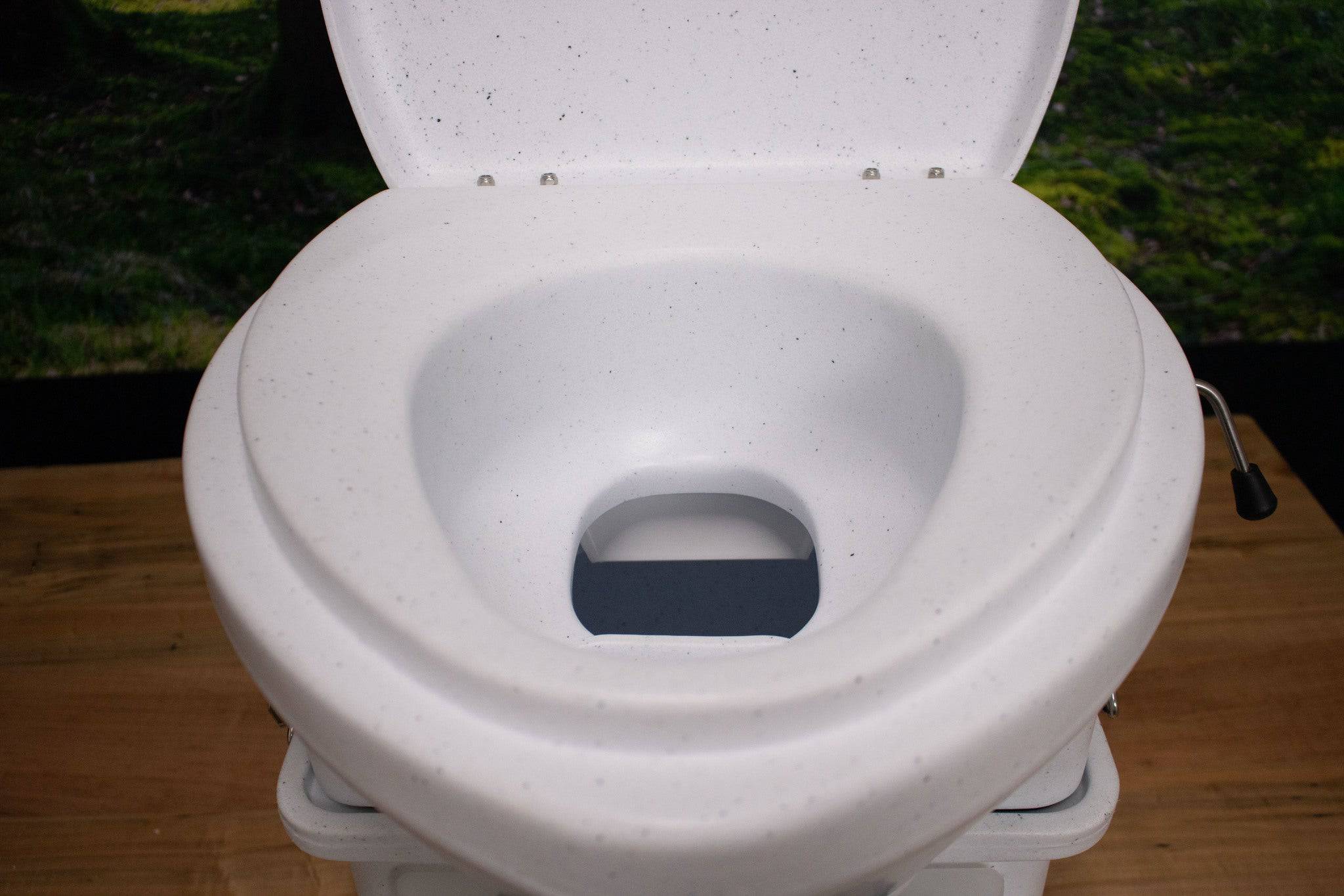 Nature's Head composting toilet with foot spider handle, available at Cabin Depot. Eco-friendly off-grid solution for remote areas.