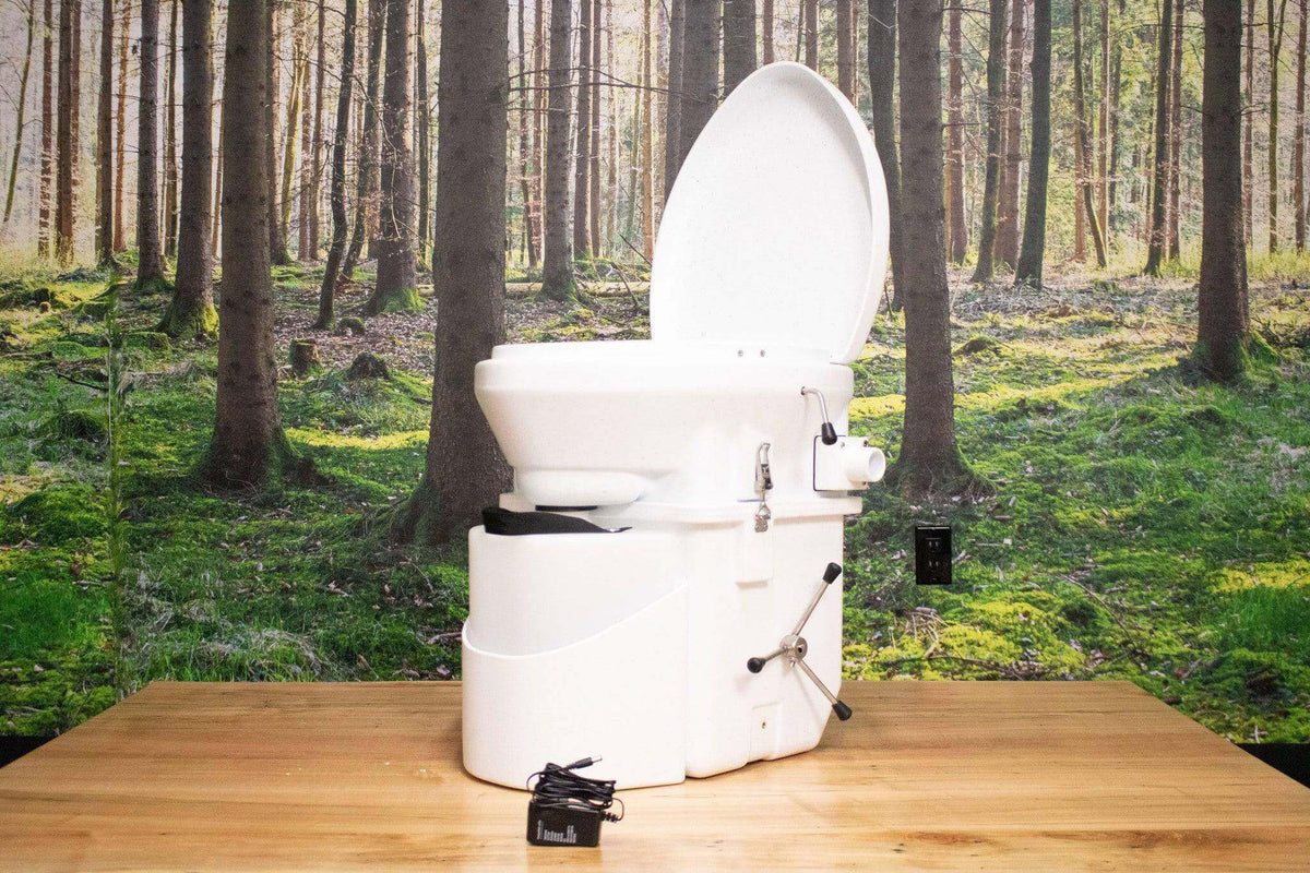 Nature's Head Composting Toilet with Spider Handle from Cabin Depot in forest setting