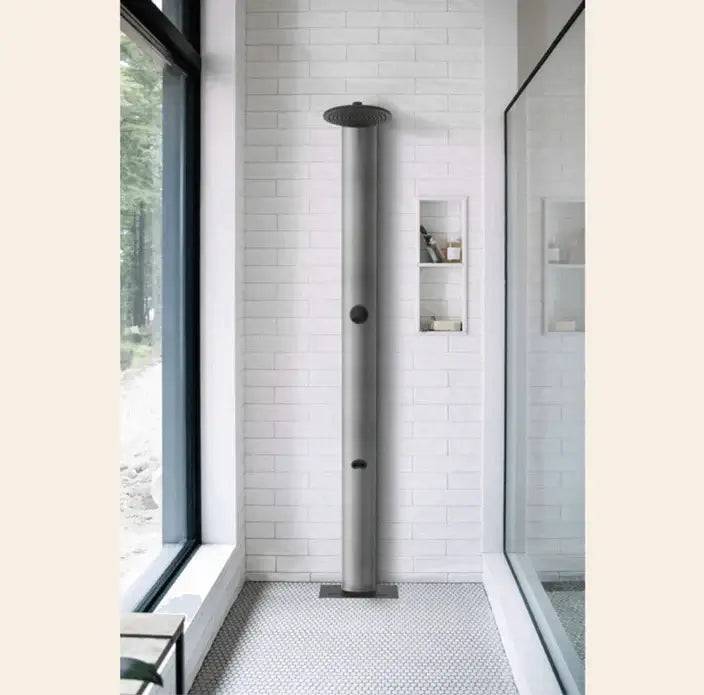 RainStick Shower in a modern bathroom, featuring matte black finish, energy-saving design, available at Cabin Depot.