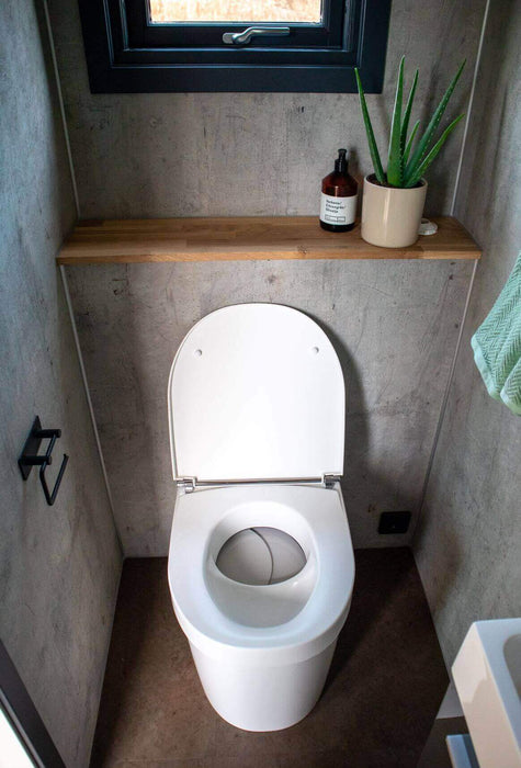 Separett Tiny 1271 Toilet in compact bathroom setting, ideal for small spaces like cabins and RVs, available at Cabin Depot