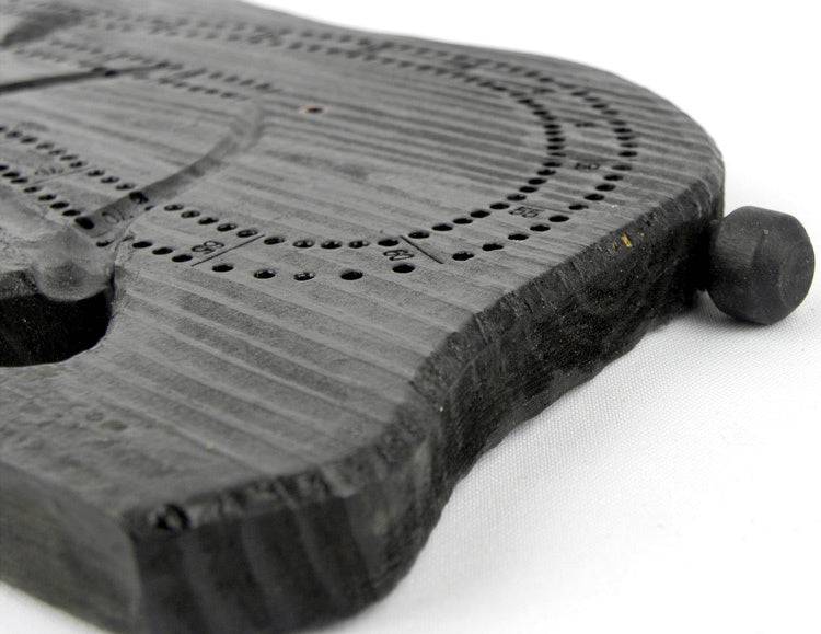 Close-up of NWL hand-carved bear cribbage board made from real wood, available at Cabin Depot. Features detailed craftsmanship and storage for pegs.