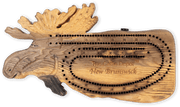 Hand-carved moose cribbage board from Cabin Depot, detailed rustic decor piece with peg storage for cabin game nights.