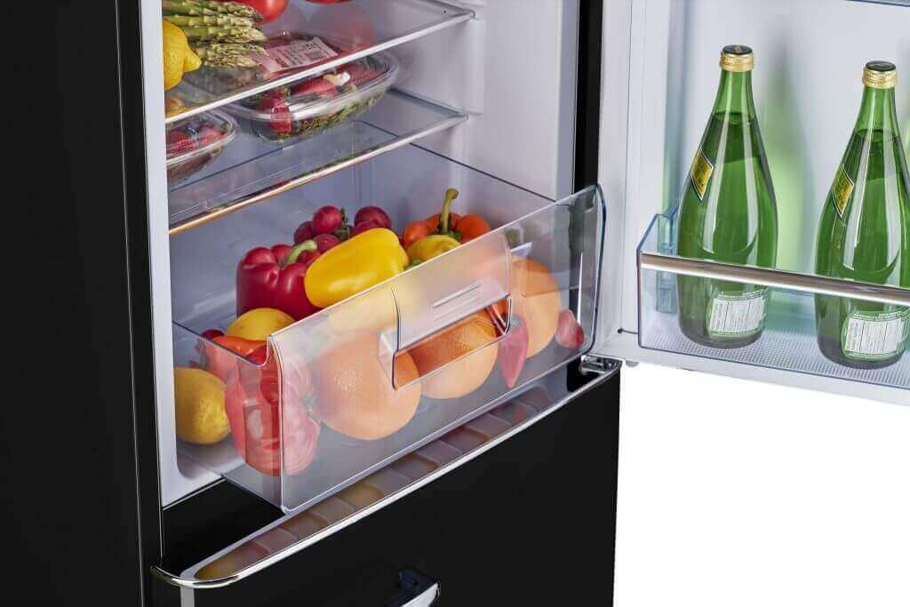 Spacious interior of Unique 9 cu/ft Retro Bottom Mount Refrigerator at Cabin Depot, showcasing organized food and beverage storage.