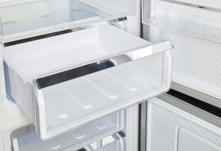 Open drawer inside Prestige 12 Cu/Ft Stainless Steel Electric Bottom Mount Refrigerator by Cabin Depot.
