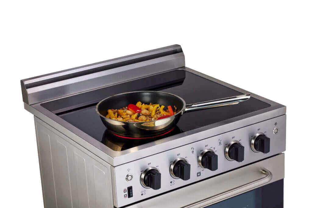 24" Stainless Steel Prestige Electric Range with food, Cabin Depot kitchen appliances, smooth glass cooktop, convection cooking.