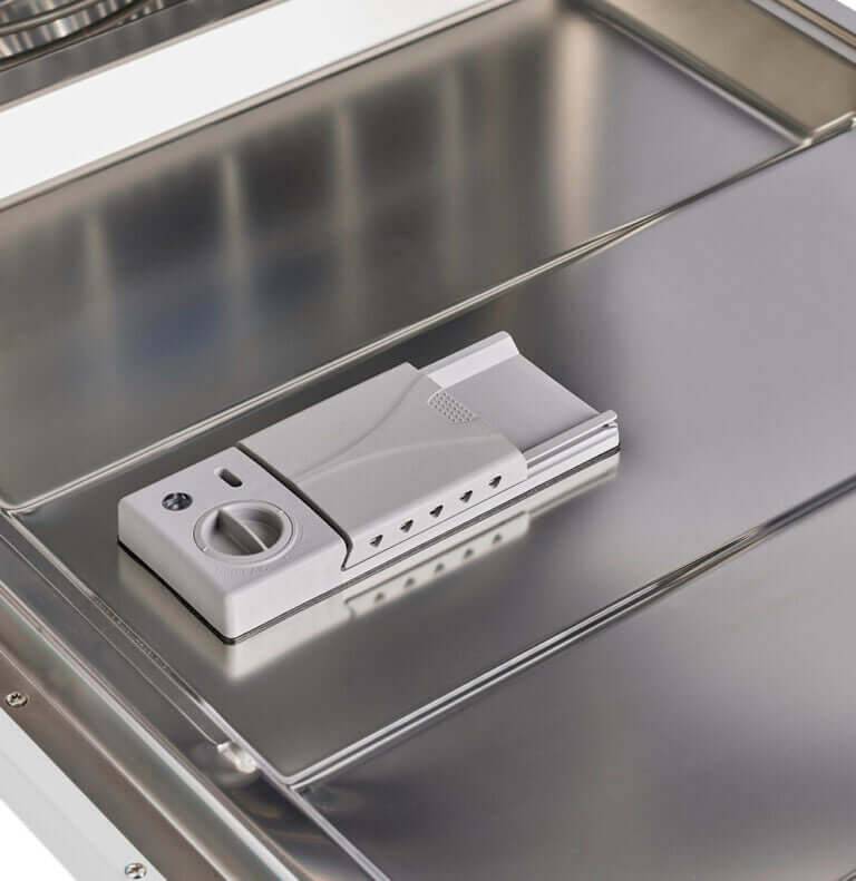 Interior view of Unique 24" Classic Retro Dishwasher detergent compartment, showcasing sleek design available at Cabin Depot.
