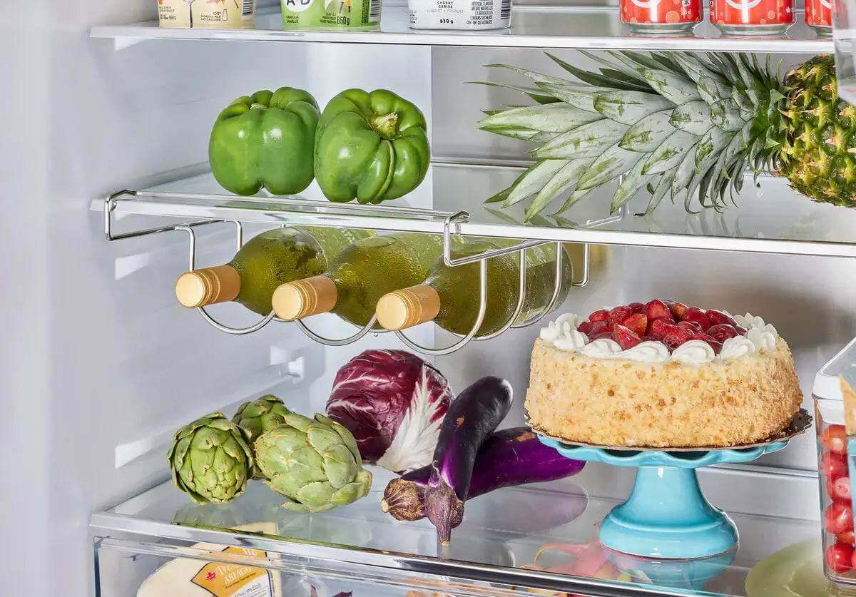 Interior view of 21.4 cu.ft. Unique French door refrigerator with fruit, vegetables, wine, and cake. Available at Cabin Depot.