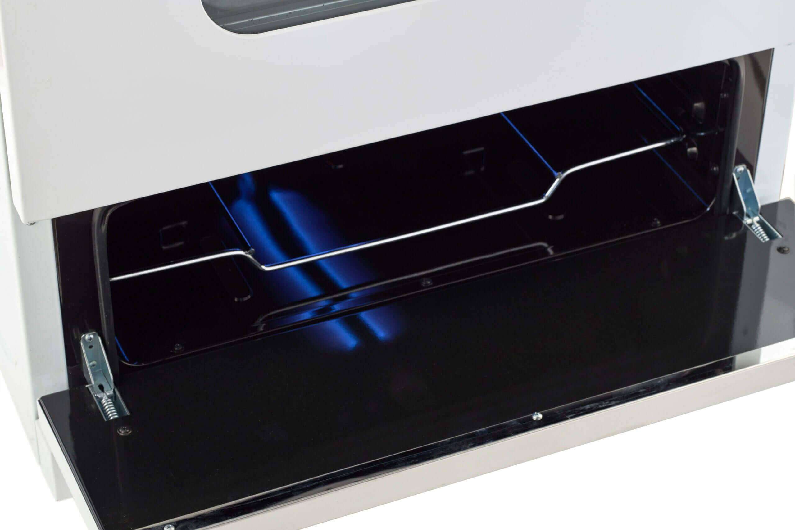 Open oven of Unique 24" Classic Retro Propane Range with battery ignition, showcasing internal view. Available at Cabin Depot.
